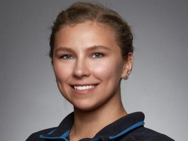 Anna smiles at the camera